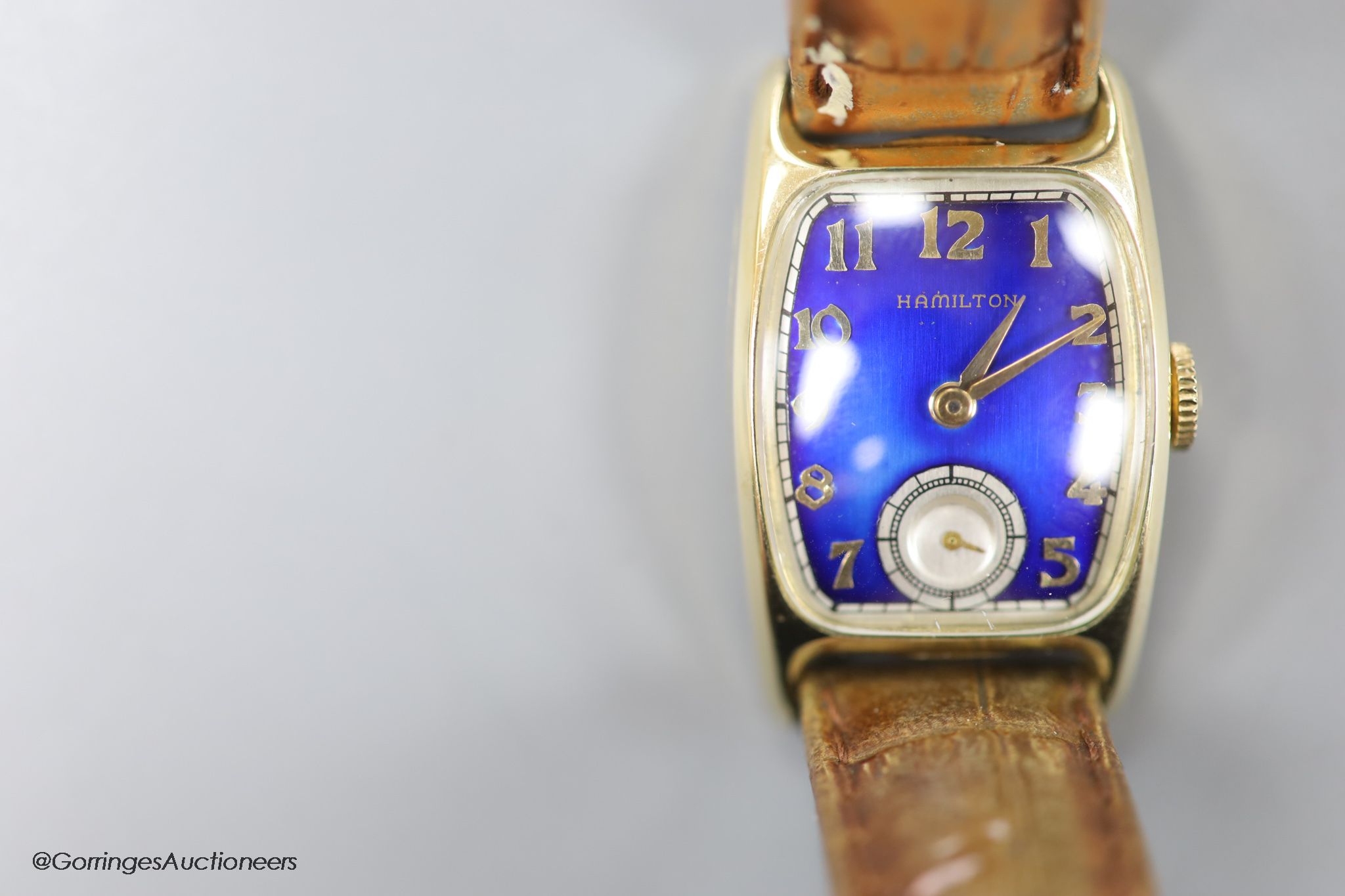 A gentleman's 1930's 14k gold filled Bulova manual wind wrist watch with blue enamel rectangular dial and subsidiary seconds, on a leather strap.